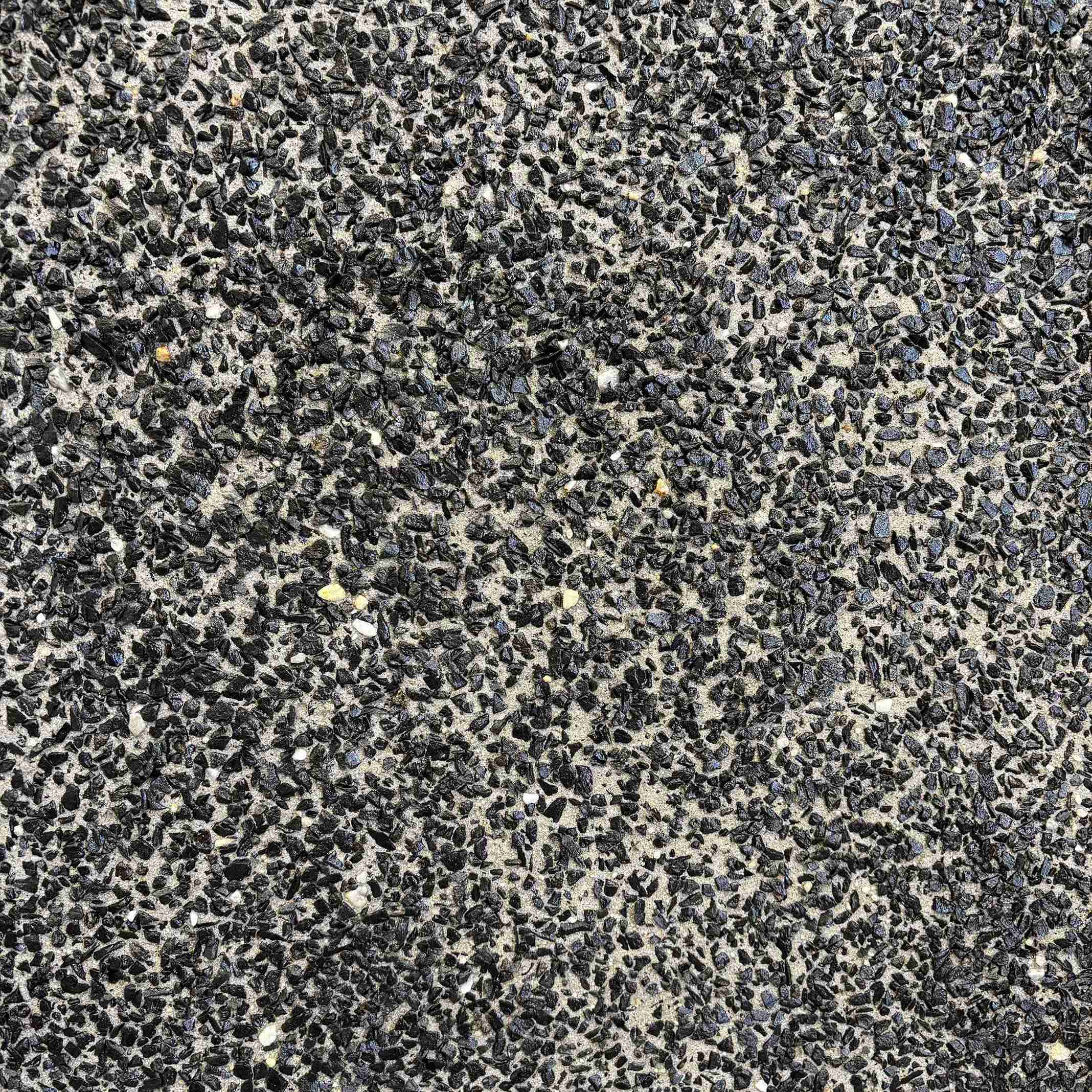 Himalayas Ash carefully selected blend of small dark stone aggregates, set in grey cement.